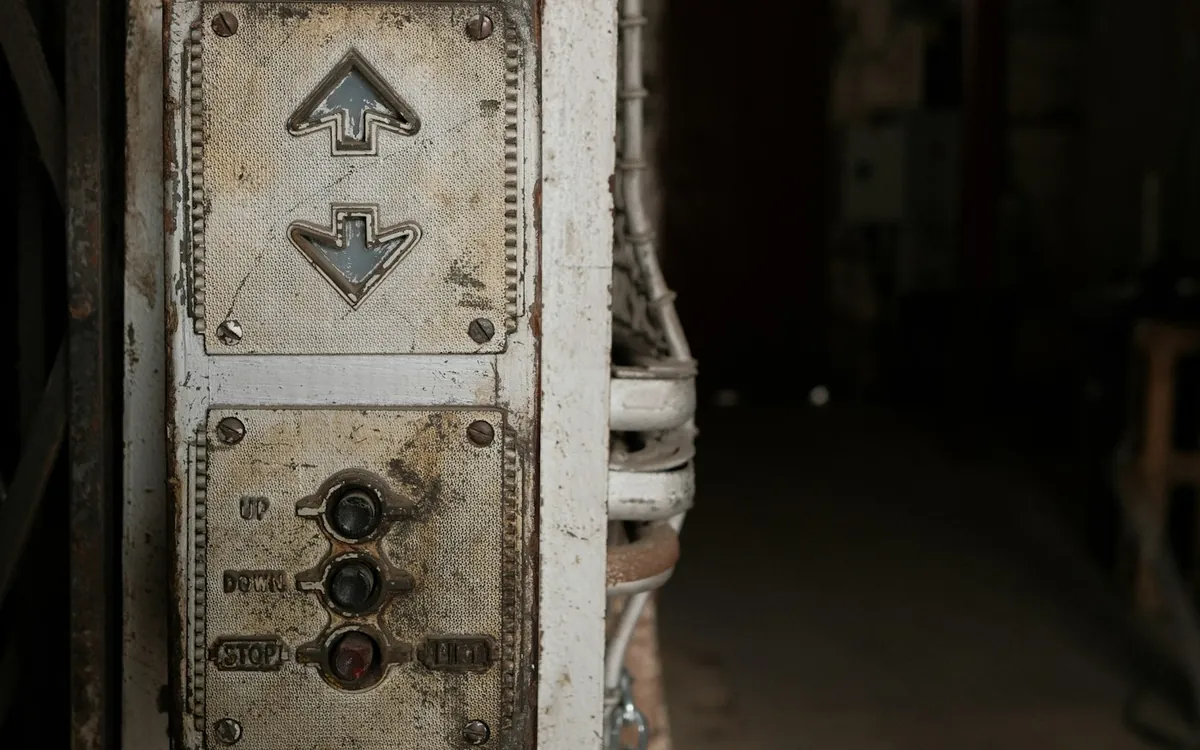 Old lift call panel with up, down and stop buttons